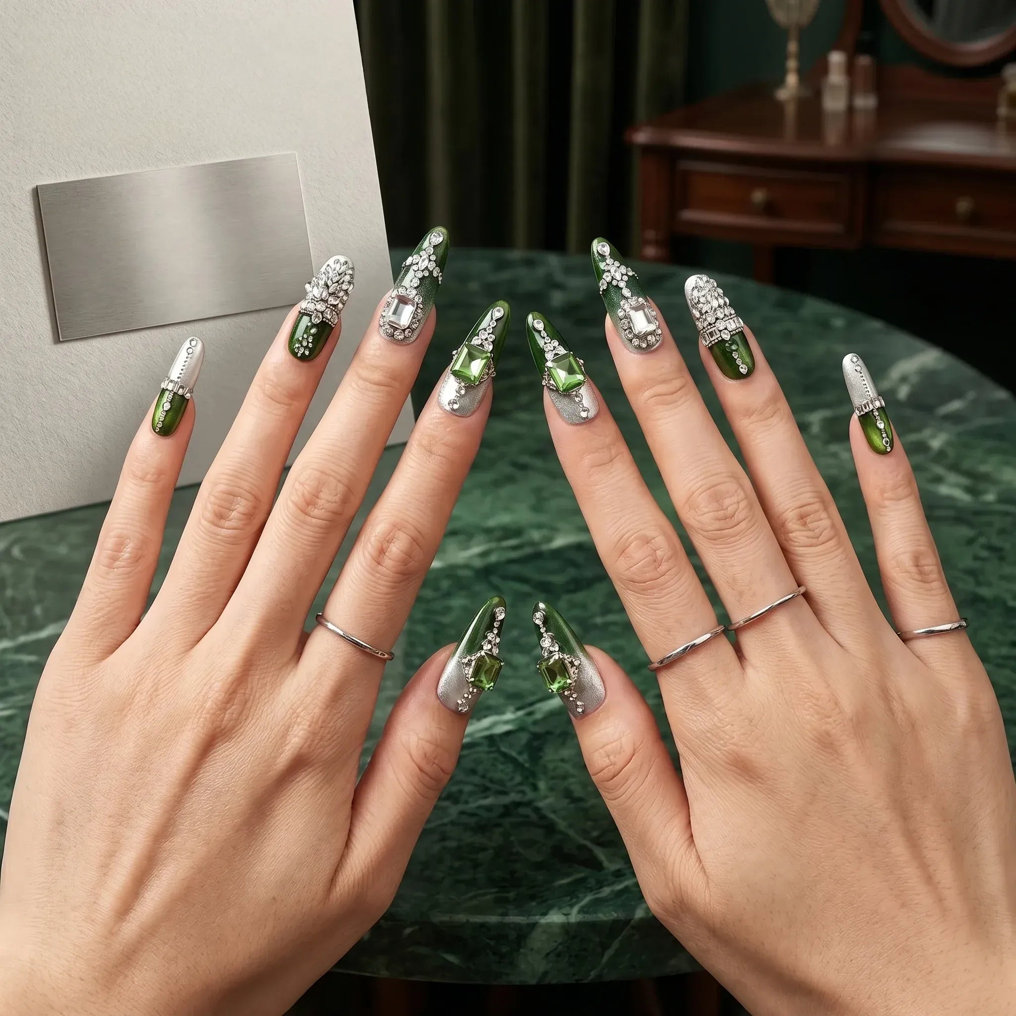 Kentrim gemstone long stiletto press on nails with green ombre, silver foil, and crystal accents, 10-piece set. Main image