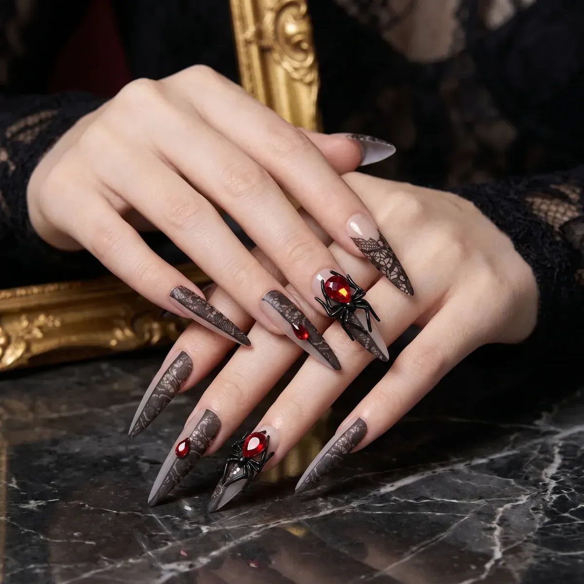 Set of 30 Kentrim black lace and red rhinestone spider press-on nails in 15 sizes, featuring long almond shape and intricate designs. Main image