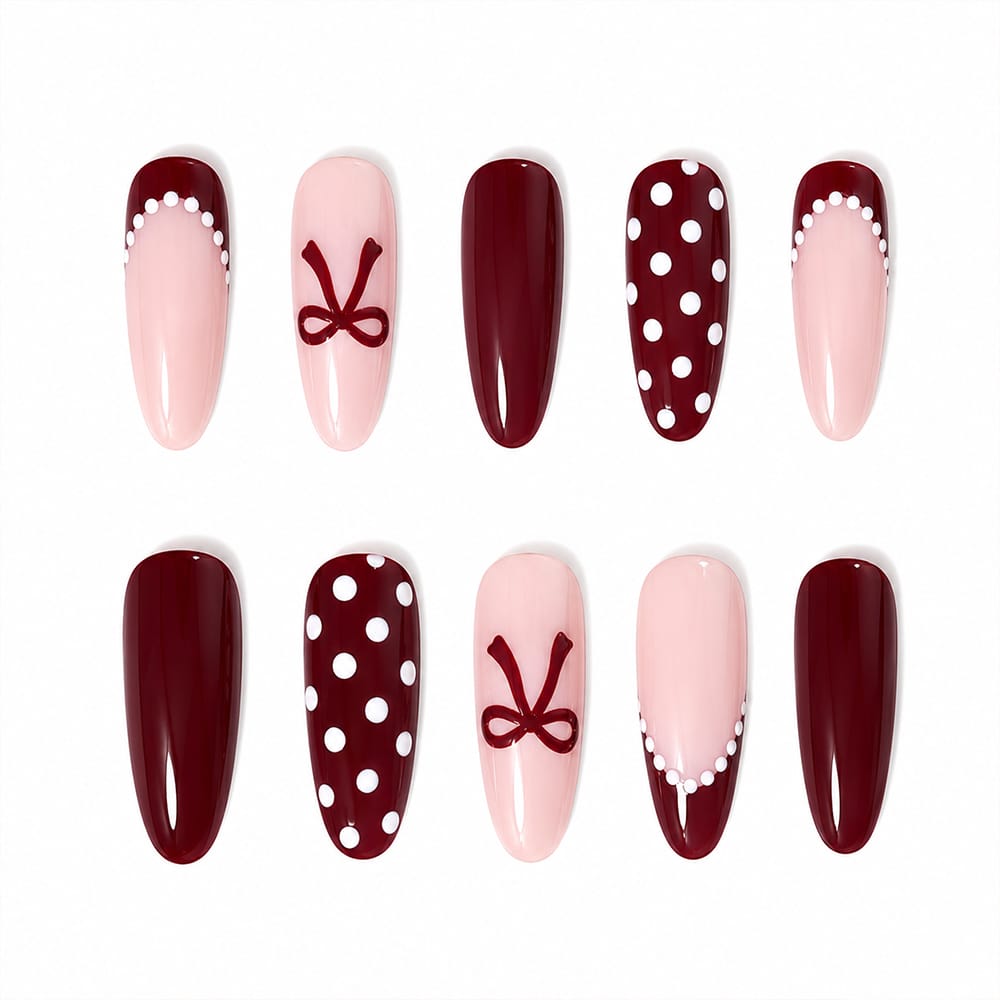 Kentrim burgundy polka dot bow long almond press-on nails in nude, 30-piece set with 15 sizes for natural nail look. Main image