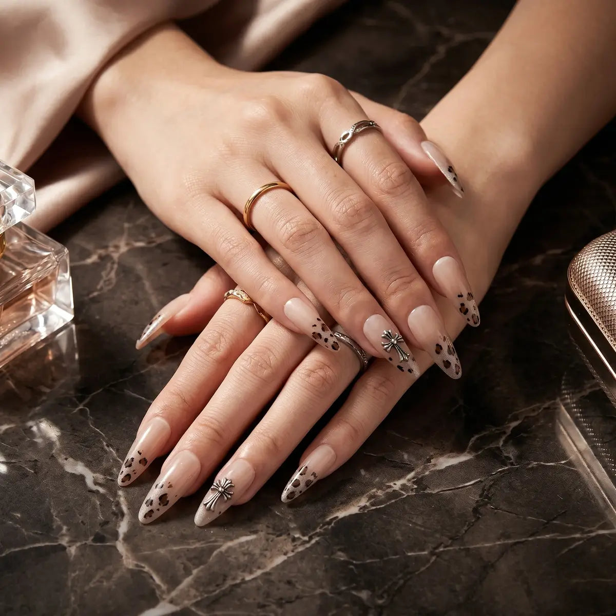 Kentrim nude gradient leopard cross metal almond press-on nails, 30 pieces with 15 sizes, showcasing stylish nail design and variety. Main image