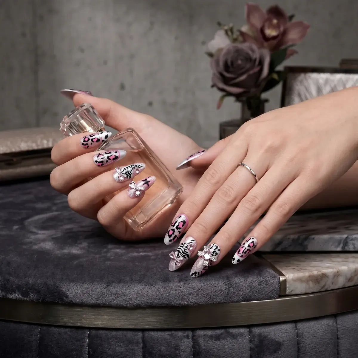 Kentrim pink leopard zebra star rhinestone almond press-on nails set with 30 pieces and 15 sizes for stylish manicures. Main image